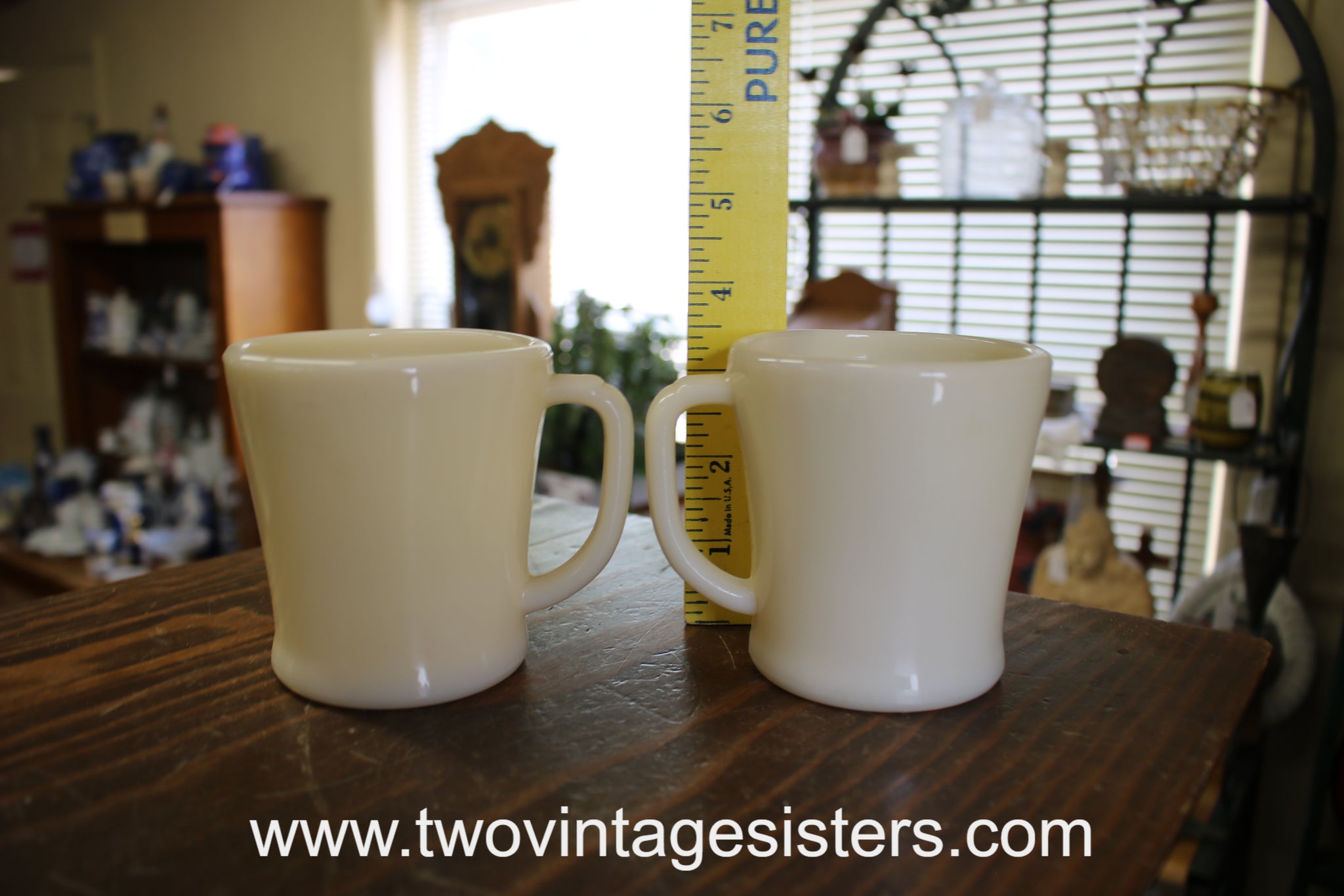 https://www.twovintagesisters.com/cdn/shop/files/FireKing-Swirl-MilkGlass-CoffeeMugs_1_1024x1024@2x.jpg?v=1684890008